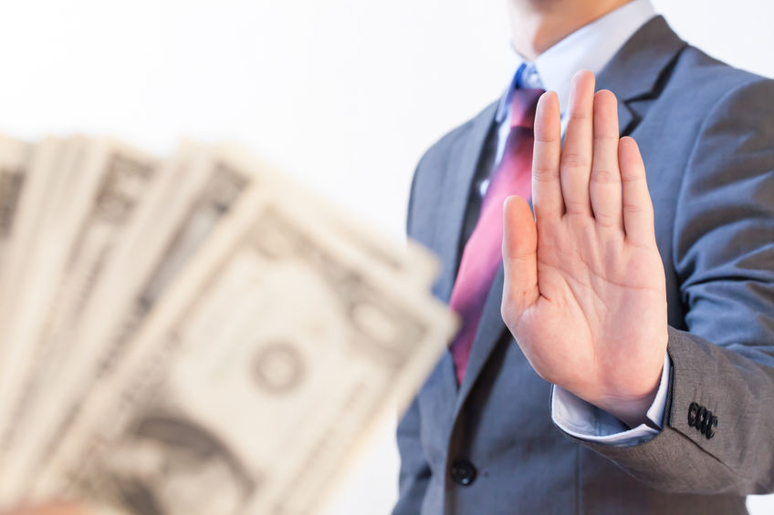 Businessman refuses to receive money – no bribery and corruption concept